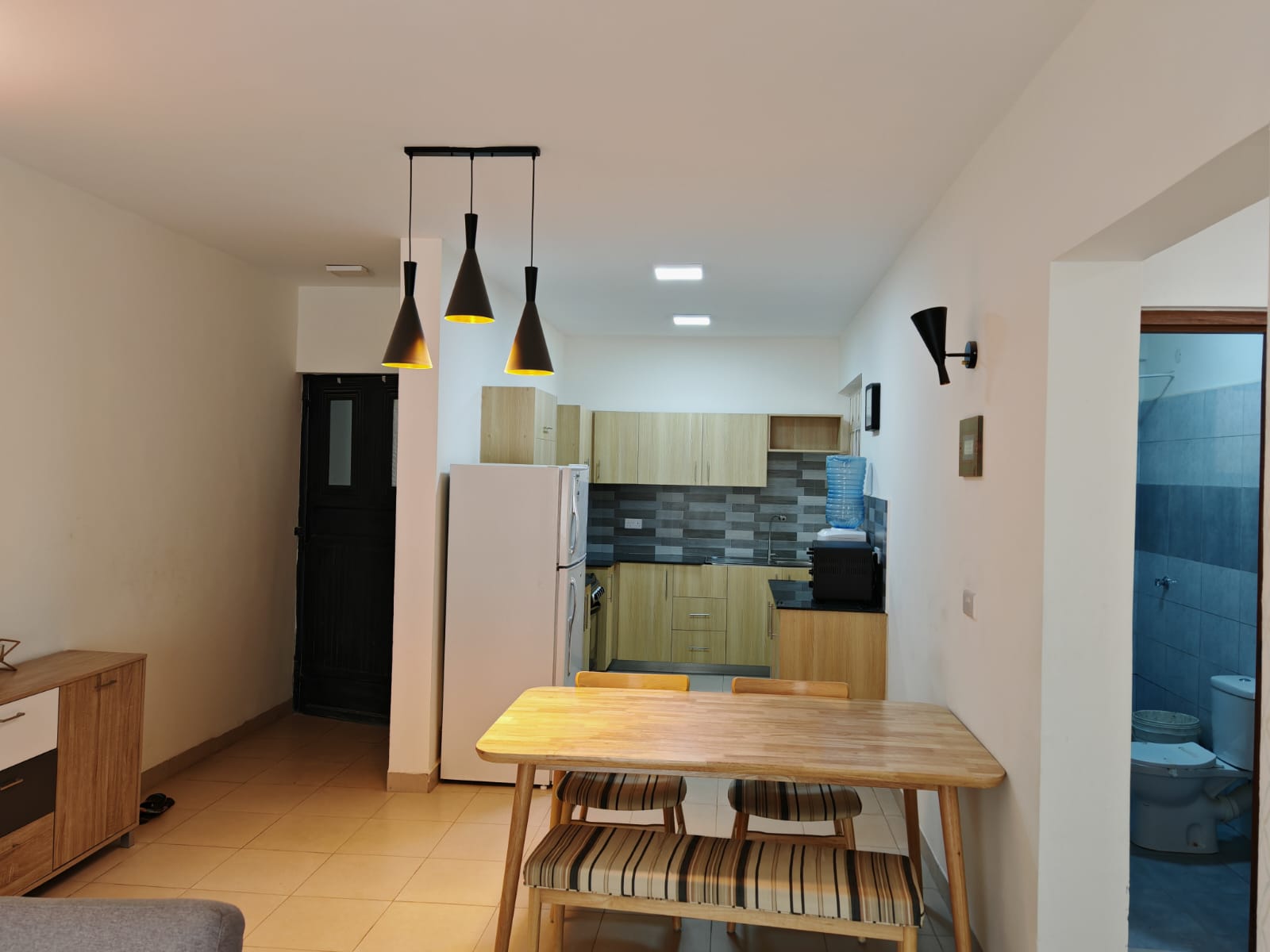 Modern 2- and 3-bedroom apartments for sale in Ongata Rongai, featuring open-plan living, a stylish kitchen, and a cozy, well-lit interior ideal for families.