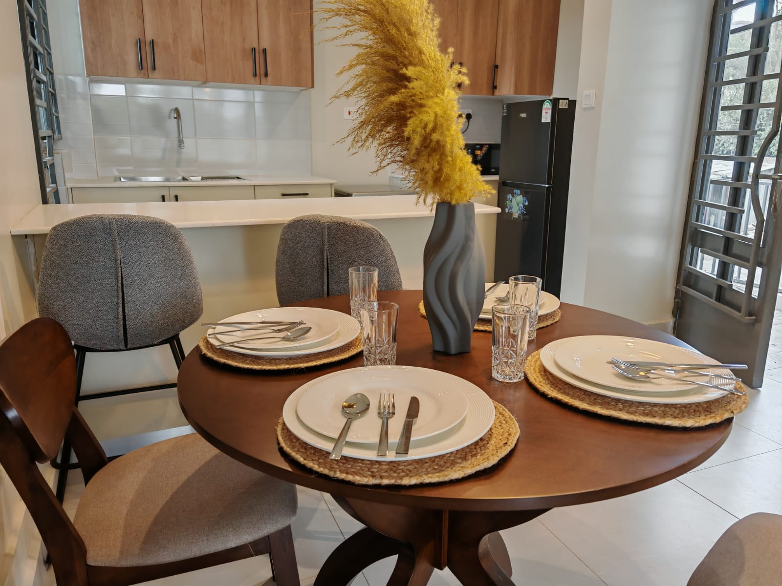 Modern 1- and 2-bedroom apartments with open-plan layouts, sleek kitchens, and bright interiors, offering comfort and security in a serene urban setting.