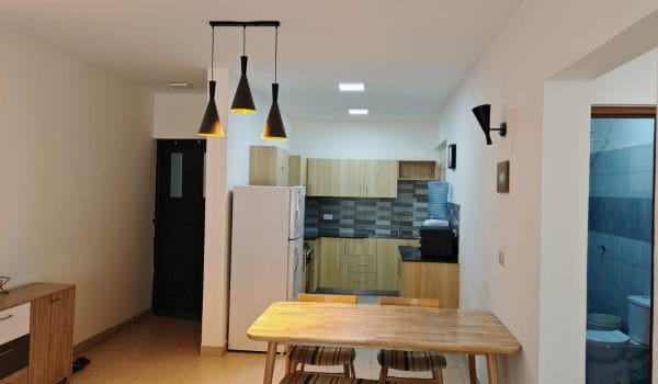 Modern 2- and 3-bedroom apartments for sale in Ongata Rongai, featuring open-plan living, a stylish kitchen, and a cozy, well-lit interior ideal for families.